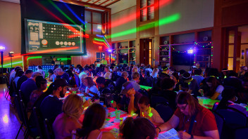 photo of We Are Weekend 2026 attendees playing glow-in-the-dark bingo in Robb Hall at Hintz, by Steve Tressler