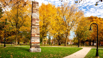 photo of the obelisk at University Park amid fall leaves, by Nick Sloff '92 A&A