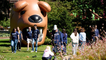 alums gathered around a large inflatable Nittany Lion in the Hintz garden, photo by Penn State Alumni Association
